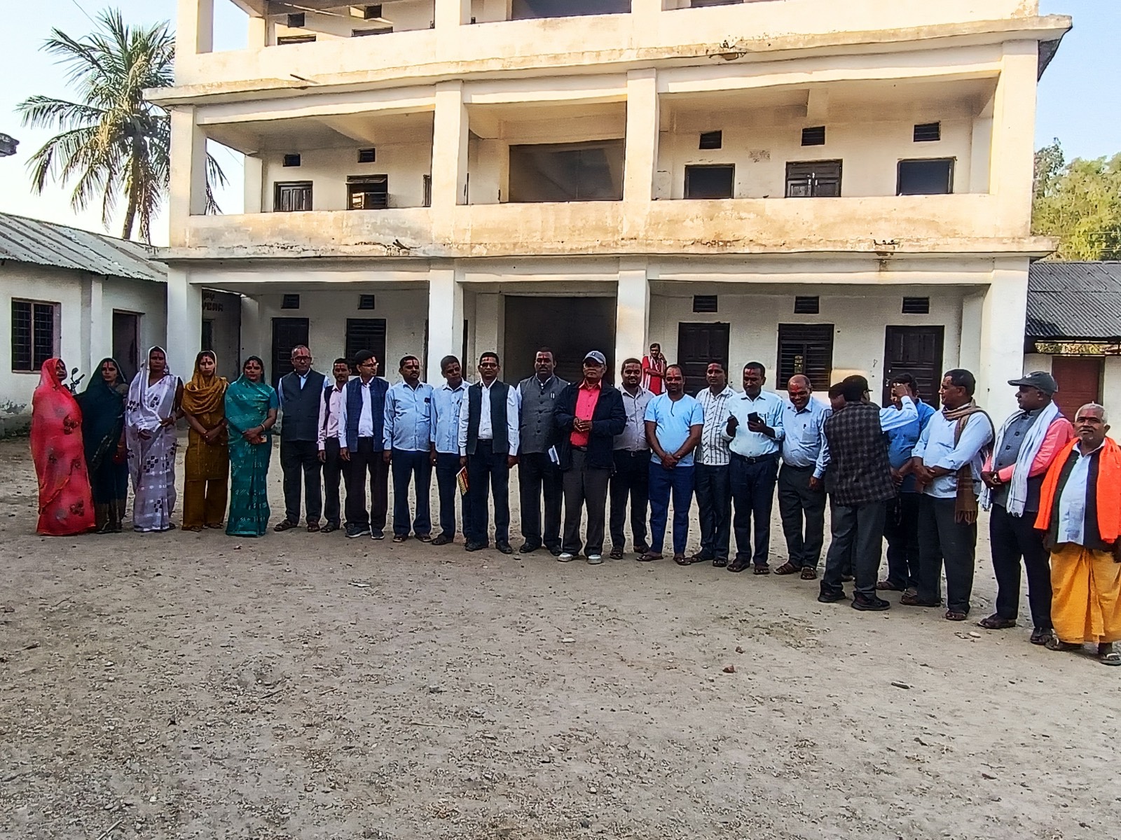 Shree Basic School building with staff members