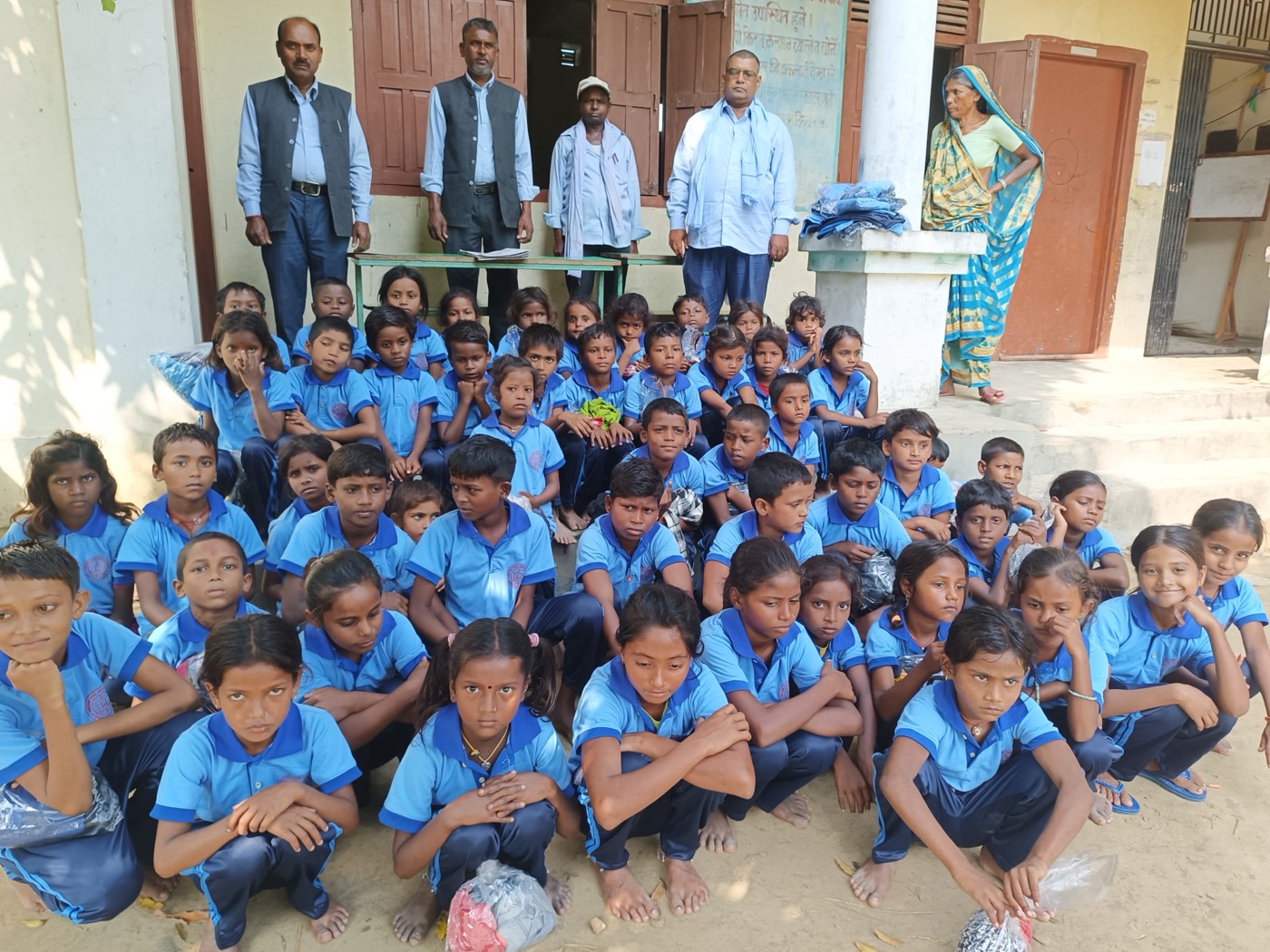 Students receiving uniforms