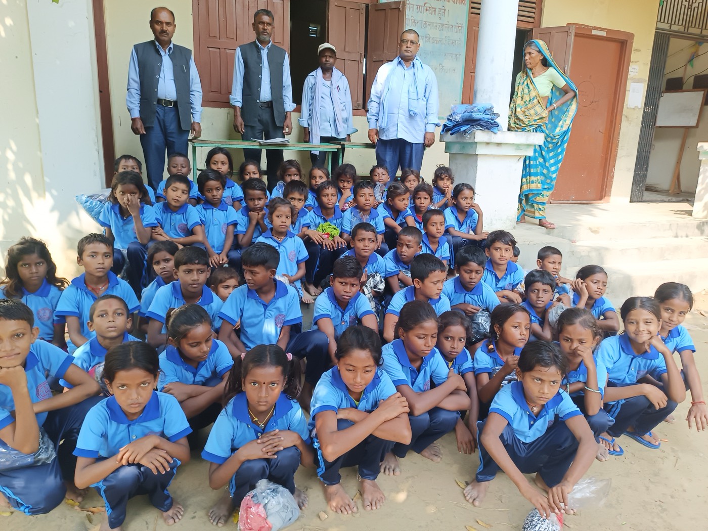 Students receiving uniforms