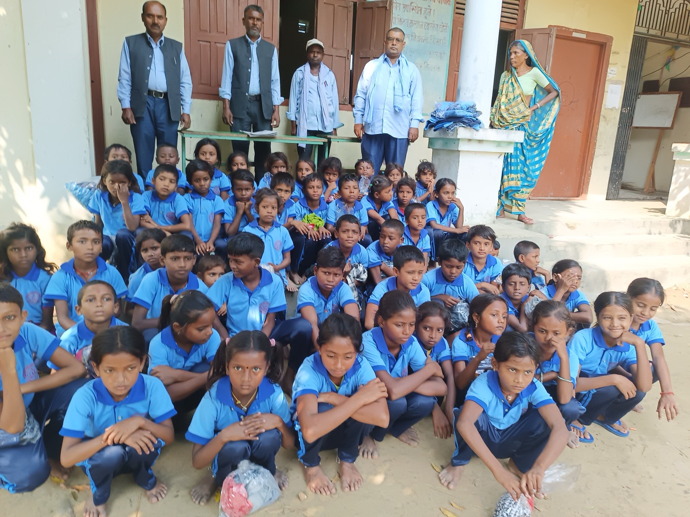 Students receiving uniforms